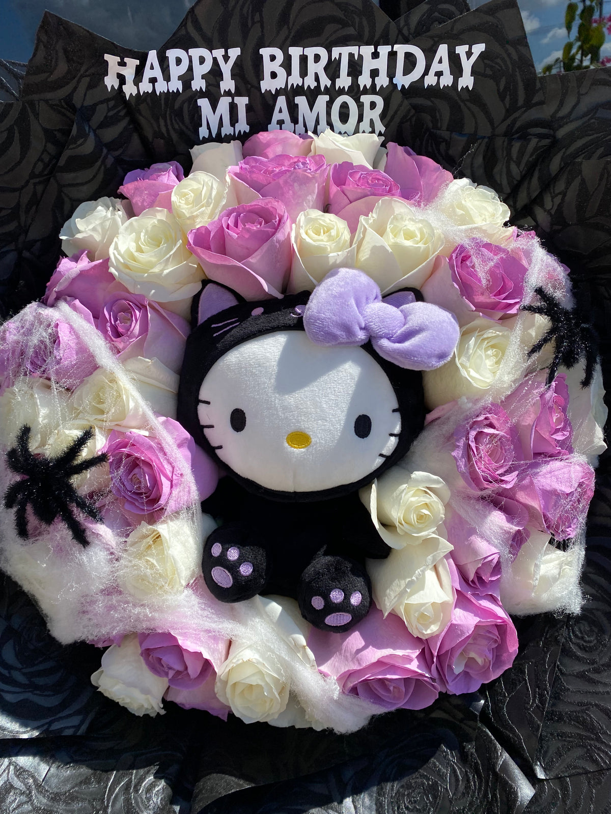 Spooky hello kitty surrounded by 50 roses💜🐈‍⬛